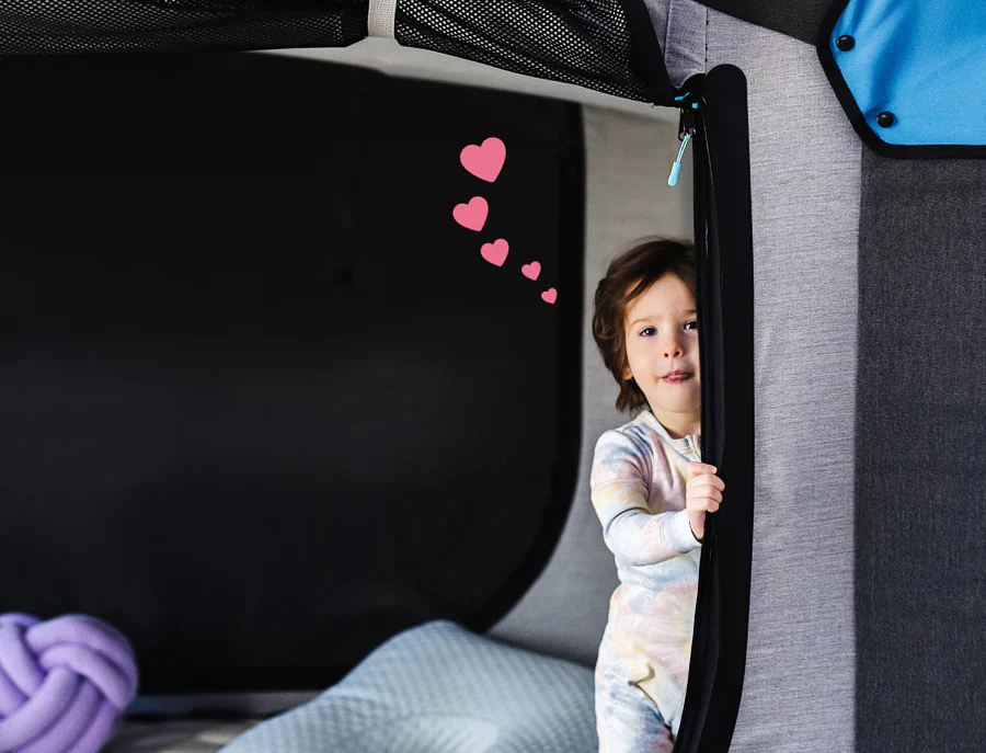 A specialized Cubby Bed for pediatric safety and sensory support, featuring an enclosed canopy design in a modern, cloud-themed child's bedroom.
